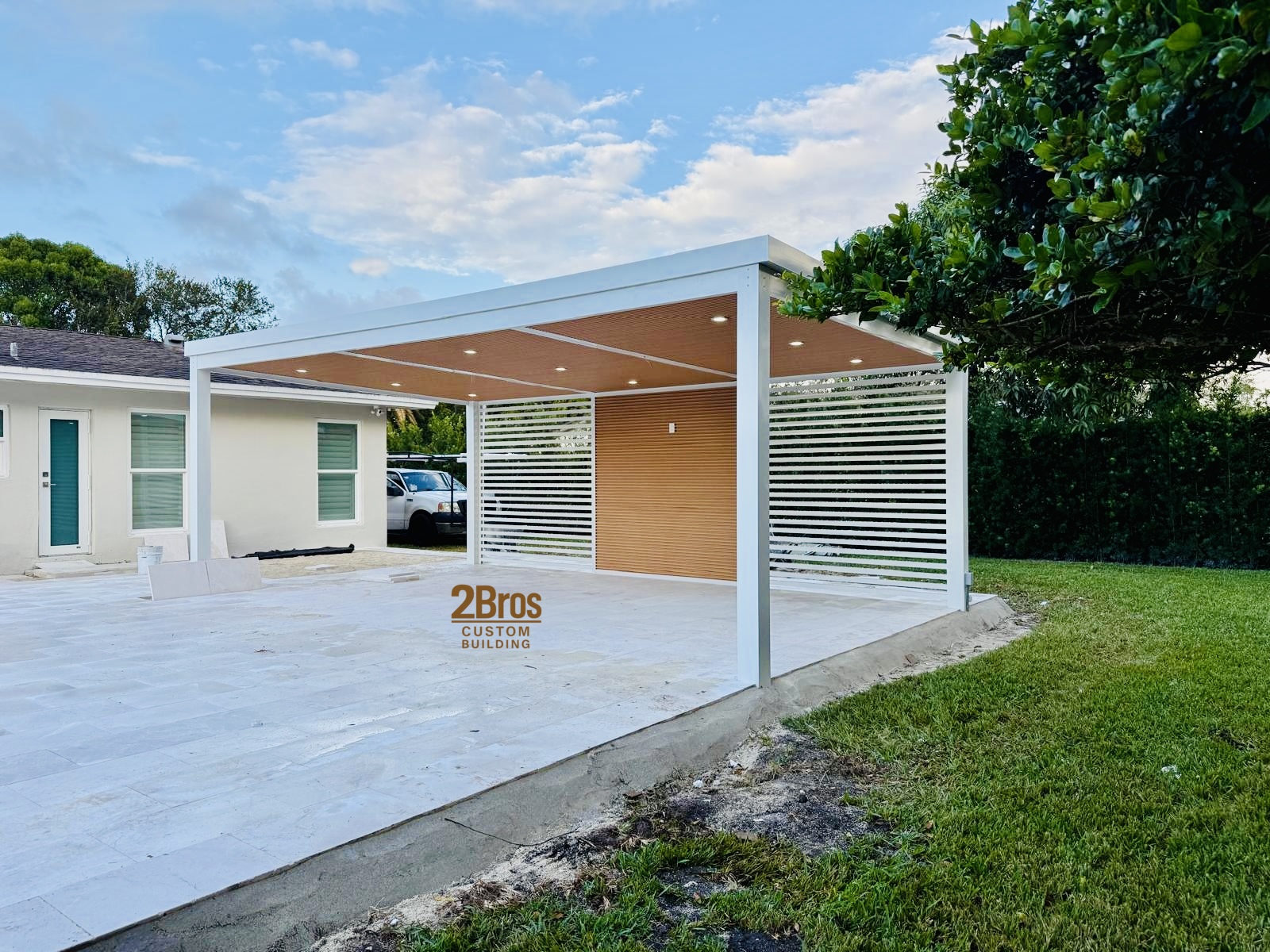 White pergola side view with louvered privacy wall