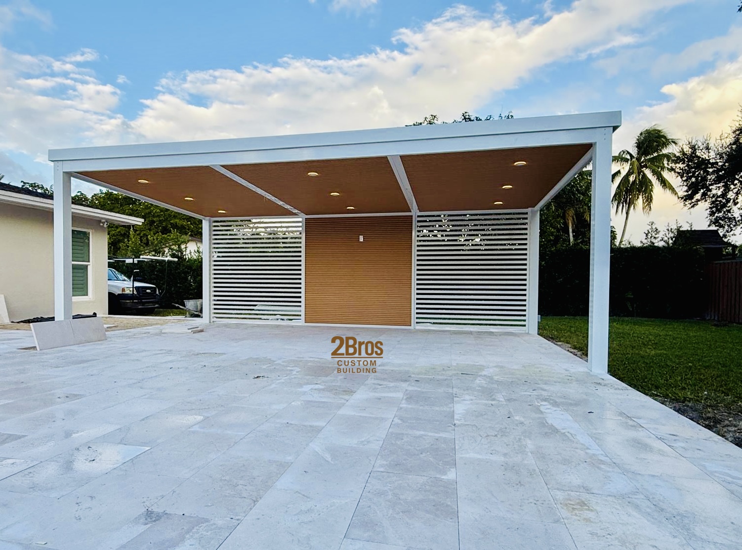 White pergola front elevation with marble pavers